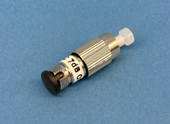 Close-up of a Plug type, singlemode 7dB fixed attenuator at 1300/1550nm with male to female FC/Ultra PC connector