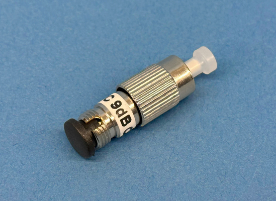Close-up of a Plug type, singlemode 9dB fixed attenuator at 1300/1550nm with male to female FC/Ultra PC connectors.